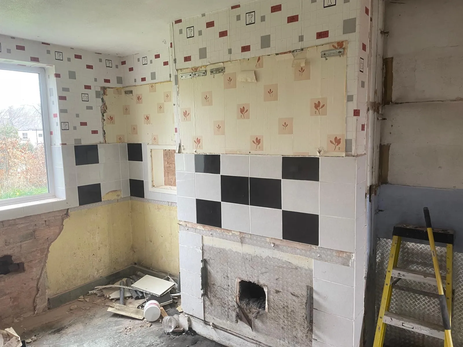 The old kitchen tiles and chimney breast