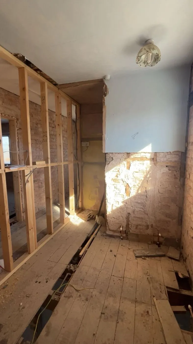 Inside stripped back to the studwork