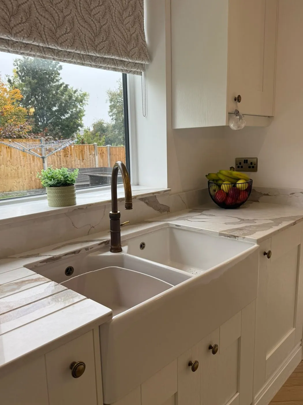 Ceramic sink under the window
