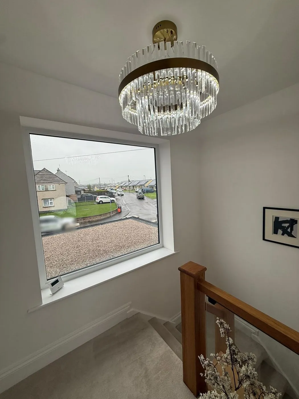 Landing window and chandelier